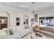 Bright living room with modern sofas, a glass coffee table, and access to an outdoor pool area at 8717 54Th E Ave, Bradenton, FL 34211