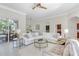 Bright living room showcasing neutral decor and large windows offering natural light and views at 8717 54Th E Ave, Bradenton, FL 34211