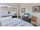 Relaxing main bedroom featuring pool access through sliding glass doors and decorative artwork at 8717 54Th E Ave, Bradenton, FL 34211