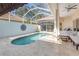 This is a screened-in private pool with a tanning ledge and plenty of room for outdoor seating at 8717 54Th E Ave, Bradenton, FL 34211