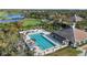 Overhead view of the pool and recreational area featuring meticulously landscaped grounds and mature trees at 8717 54Th E Ave, Bradenton, FL 34211