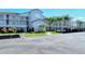 Well-maintained condo complex with covered parking and tropical landscaping at 8735 Olde Hickory Ave # 8210, Sarasota, FL 34238
