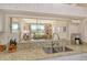 Kitchen featuring white cabinetry, granite countertops, and a breakfast bar at 8735 Olde Hickory Ave # 8210, Sarasota, FL 34238