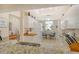 Bright kitchen featuring white cabinetry, granite countertops, and a breakfast nook with views at 8735 Olde Hickory Ave # 8210, Sarasota, FL 34238