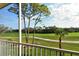 Screened lanai offering peaceful views of the golf course at 8735 Olde Hickory Ave # 8210, Sarasota, FL 34238