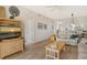 Cozy living room with a large flat screen TV and bright overhead lighting at 8735 Olde Hickory Ave # 8210, Sarasota, FL 34238