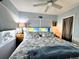 Comfortable bedroom offers a calming color scheme and natural light from large windows at 10315 Cortez W Rd # 12-3, Bradenton, FL 34210