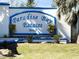 Welcoming entrance sign to Paradise Bay Estates, enhancing curb appeal and community charm at 10315 Cortez W Rd # 12-3, Bradenton, FL 34210