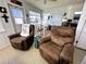 Inviting living room with comfortable seating and a view of the dining area and kitchen at 10315 Cortez W Rd # 12-3, Bradenton, FL 34210