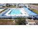 Community pool with clear blue water, lounge chairs, and a clubhouse for relaxation and social gatherings at 10315 Cortez W Rd # 12-3, Bradenton, FL 34210