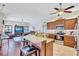 This lovely kitchen features granite countertops, stainless appliances, and a seamless flow into the living room at 104 Inlets Blvd # 104, Nokomis, FL 34275