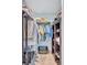 Organized walk-in closet with shelves, hanging rods, and storage for clothes and accessories at 104 Inlets Blvd # 104, Nokomis, FL 34275