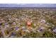 Wide aerial shot of the neighborhood, highlighting community layout and nearby residential properties at 1124 Ample Ave, Port Charlotte, FL 33948