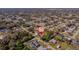 An aerial view showing the property's location within a residential neighborhood with lush greenery at 1124 Ample Ave, Port Charlotte, FL 33948