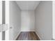 This is a closet with gray walls and wood grain flooring at 1124 Ample Ave, Port Charlotte, FL 33948