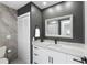 Chic bathroom features modern vanity with quartz countertop and elegant fixtures at 124 Mark Twain Ln, Rotonda West, FL 33947