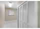 Well-lit hallway with tile flooring and closet that offers ample storage space at 124 Mark Twain Ln, Rotonda West, FL 33947