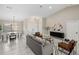 Bright living room with white floors, neutral walls, and modern furniture at 124 Mark Twain Ln, Rotonda West, FL 33947