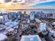 Aerial view of a cityscape featuring a modern building and the beautiful waterfront at 1335 2Nd St # 402, Sarasota, FL 34236