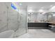 Beautiful bathroom featuring a soaking tub, a glass-enclosed shower, and a double vanity with a makeup station at 1335 2Nd St # 402, Sarasota, FL 34236