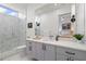 Modern bathroom featuring a glass walk-in shower, sleek vanity, and a calming view into the adjacent bedroom at 1335 2Nd St # 402, Sarasota, FL 34236