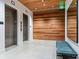 Elevator lobby with wood wall, bench, and mirror at 1335 2Nd St # 402, Sarasota, FL 34236