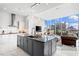 Modern kitchen with a large island, stainless steel appliances, and city views at 1335 2Nd St # 402, Sarasota, FL 34236