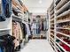 Organized walk-in closet features custom shelving for clothing, shoes, and accessories at 1335 2Nd St # 402, Sarasota, FL 34236