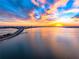 A stunning sunset over a bridge and tranquil waters, creating a picturesque waterfront scene at 1335 2Nd St # 402, Sarasota, FL 34236