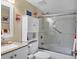 Bathroom with a white vanity, toilet, and updated shower with glass doors at 1617 Brookhouse Dr # 255, Sarasota, FL 34231