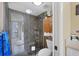 Modern bathroom featuring glass shower with shelf and storage space at 1617 Brookhouse Dr # 255, Sarasota, FL 34231