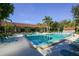 Inviting community pool with comfortable lounge chairs and clear blue water at 1617 Brookhouse Dr # 255, Sarasota, FL 34231