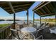 Waterfront covered deck features ample seating and scenic views of the tranquil bay at 1617 Brookhouse Dr # 255, Sarasota, FL 34231