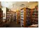 Community library featuring wooden bookshelves filled with books and comfortable seating at 1617 Brookhouse Dr # 255, Sarasota, FL 34231