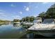 Boat marina with various watercraft docked in calm waters under a sunny sky at 1617 Brookhouse Dr # 255, Sarasota, FL 34231