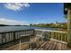 Waterfront deck with chairs, offers stunning views of the tranquil canal and surrounding nature at 1617 Brookhouse Dr # 255, Sarasota, FL 34231