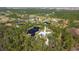 Gorgeous aerial view of a sprawling estate with multiple ponds and mature trees at 19610 66Th E Ave, Bradenton, FL 34211