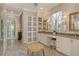 Bathroom with natural lighting, dual sinks, vanity and storage at 19610 66Th E Ave, Bradenton, FL 34211