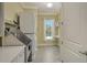 Functional laundry room with stainless steel utility sink, modern washer/dryer, and natural light at 19610 66Th E Ave, Bradenton, FL 34211