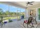 Enjoy the outdoors from this screened patio with lake views and rocking chairs at 19610 66Th E Ave, Bradenton, FL 34211