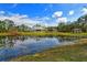 Wonderful backyard with a scenic pond reflecting the grand home at 19610 66Th E Ave, Bradenton, FL 34211