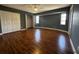 Spacious main bedroom with laminate floors, double closets, and natural light, providing ample space for relaxation at 2001 Logsdon St, North Port, FL 34287