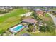 Aerial view of home with an in-ground pool and backyard golf course views at 2080 Padre Island Dr # 211, Punta Gorda, FL 33950