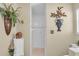 Cozy bathroom featuring a shower, decorative plant and artwork at 2080 Padre Island Dr # 211, Punta Gorda, FL 33950