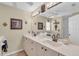 Well-lit bathroom featuring double sinks and decorative accents at 2080 Padre Island Dr # 211, Punta Gorda, FL 33950