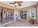 Enclosed patio featuring tile floors, a ceiling fan, and an adjacent kitchen and bedroom through sliding glass doors at 2080 Padre Island Dr # 211, Punta Gorda, FL 33950