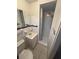 Compact bathroom with a walk-in shower and modern white fixtures at 2107 36Th E Ave, Palmetto, FL 34221