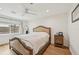 Bright bedroom with wood floors features a neutral color scheme, ceiling fan, and window at 2202 Waldemere St, Sarasota, FL 34239