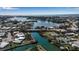 Expansive aerial shot of a waterfront community with canals leading to a bay and the open ocean at 27 Inlets Blvd # 27, Nokomis, FL 34275