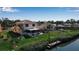 Waterfront property with manicured lawn and views of the canal at 27 Inlets Blvd # 27, Nokomis, FL 34275